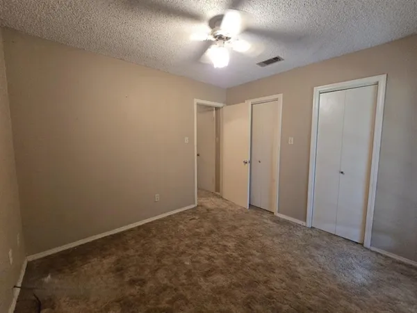 a view of a lake with houses in the background