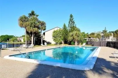 a view of a swimming pool with a yard