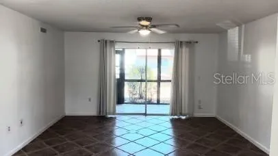 a view of an empty room with a window