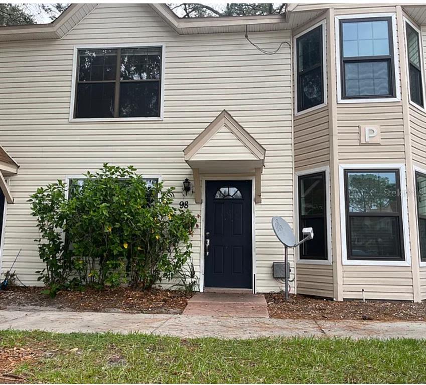 2302 South Maki Road, Unit 98 Plant City, FL 33563 - Photo 1 of 7 a view of a house with a yard and large tree
