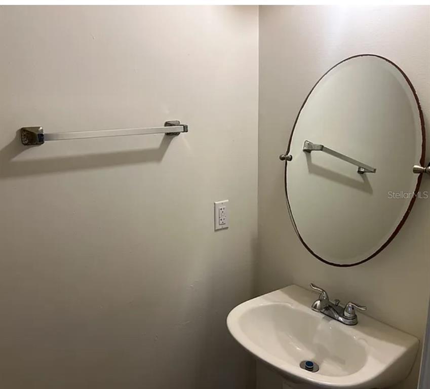 2302 South Maki Road, Unit 98 Plant City, FL 33563 - Photo 4 of 7 a bathroom with a sink and a mirror