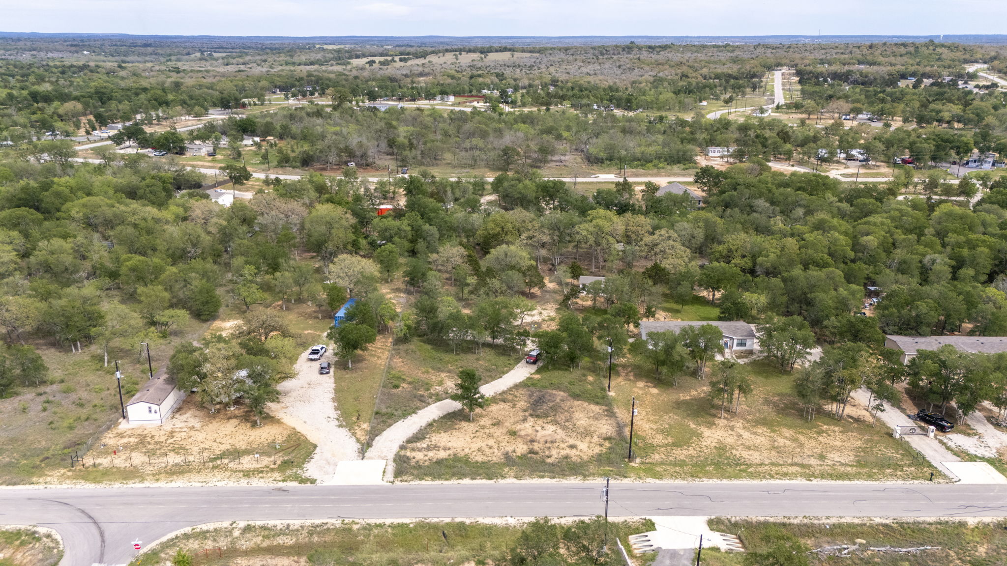 171 Comancheria Trail Elgin, TX 78621 - Photo 18 of 24 Bird's eye view of a heavily wooded area