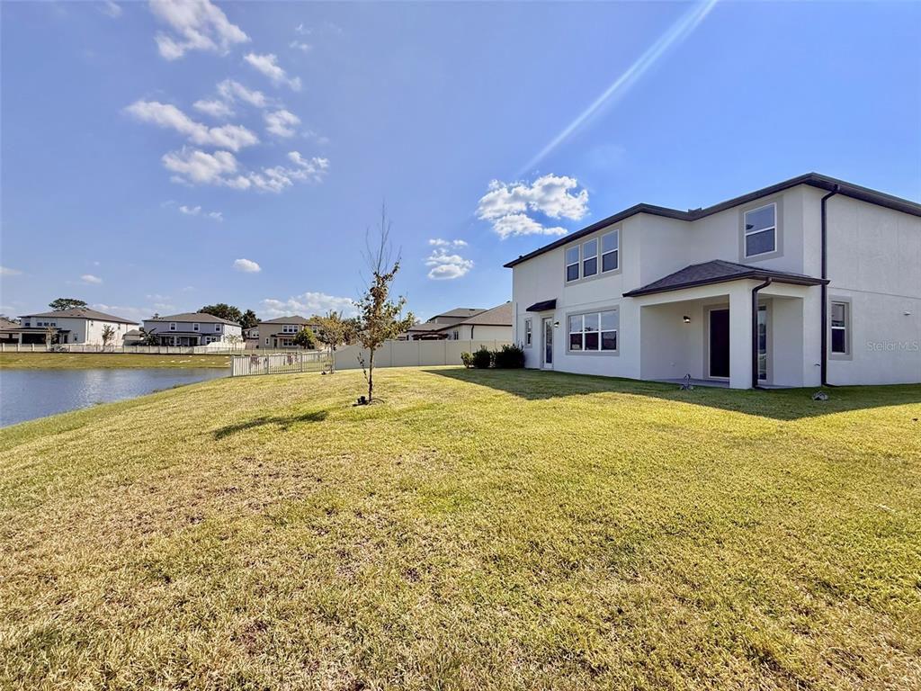 12189 Nouveau Avenue Spring Hill, FL 34610 - Photo 46 of 50 a swimming pool with outdoor seating and yard