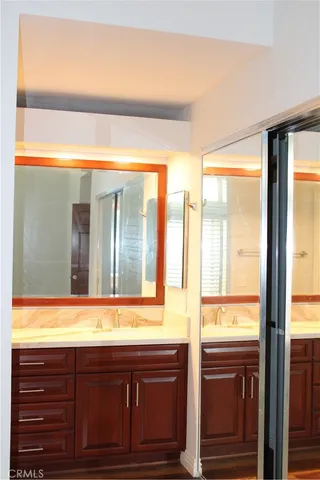 a bathroom with a sink and a mirror