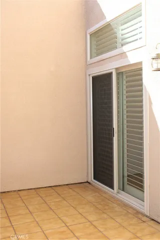 a front view of house and yard with beautiful flowers