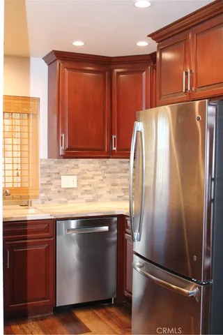 a stove top oven sitting inside of a kitchen