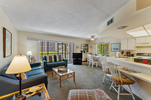 a living room with furniture and a table