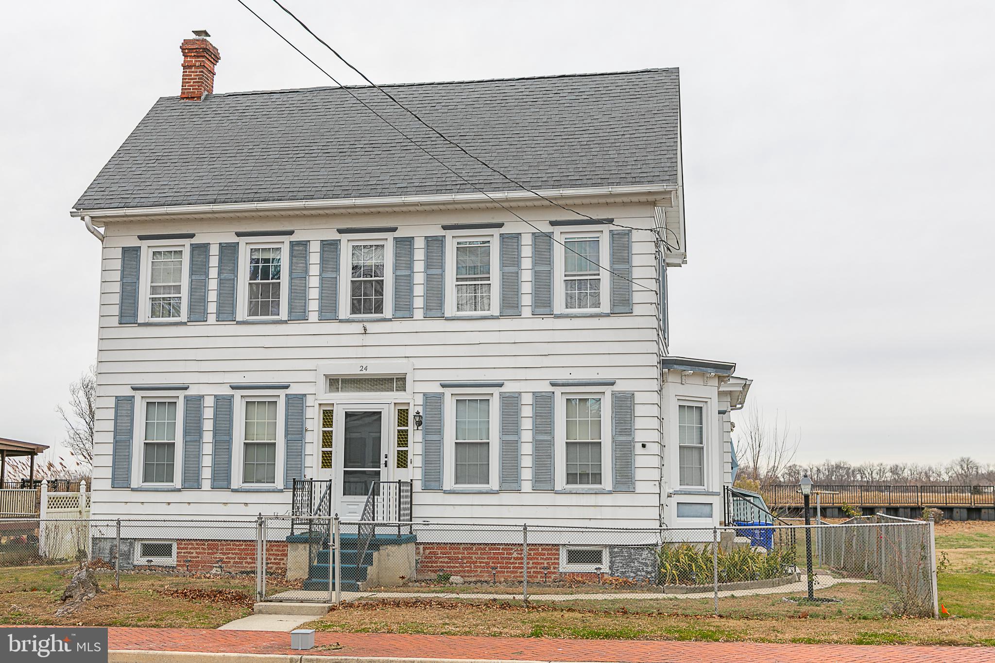 24 Front Street Hancocks Bridge, NJ 08038 - Photo 2 of 8 a front view of a house with a yard
