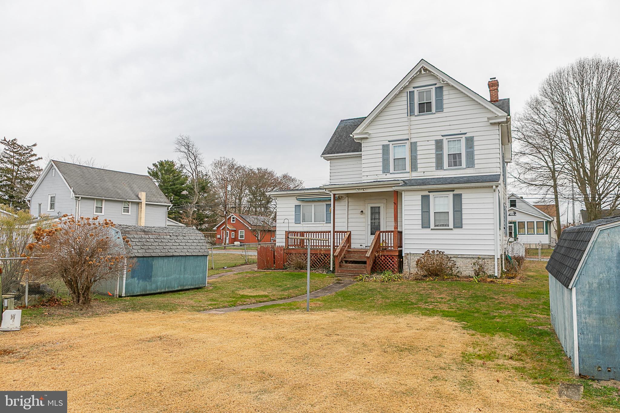 24 Front Street Hancocks Bridge, NJ 08038 - Photo 6 of 8 a front view of a house with a yard patio and fire pit