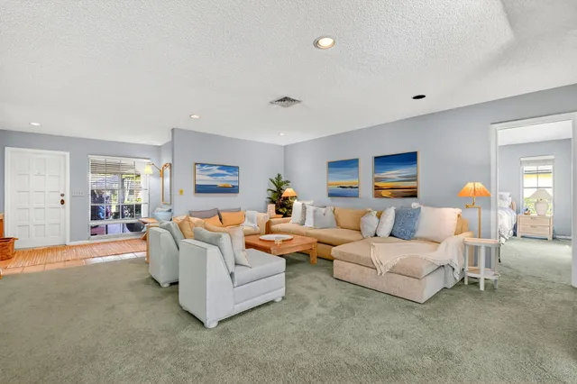 a living room with furniture and a table