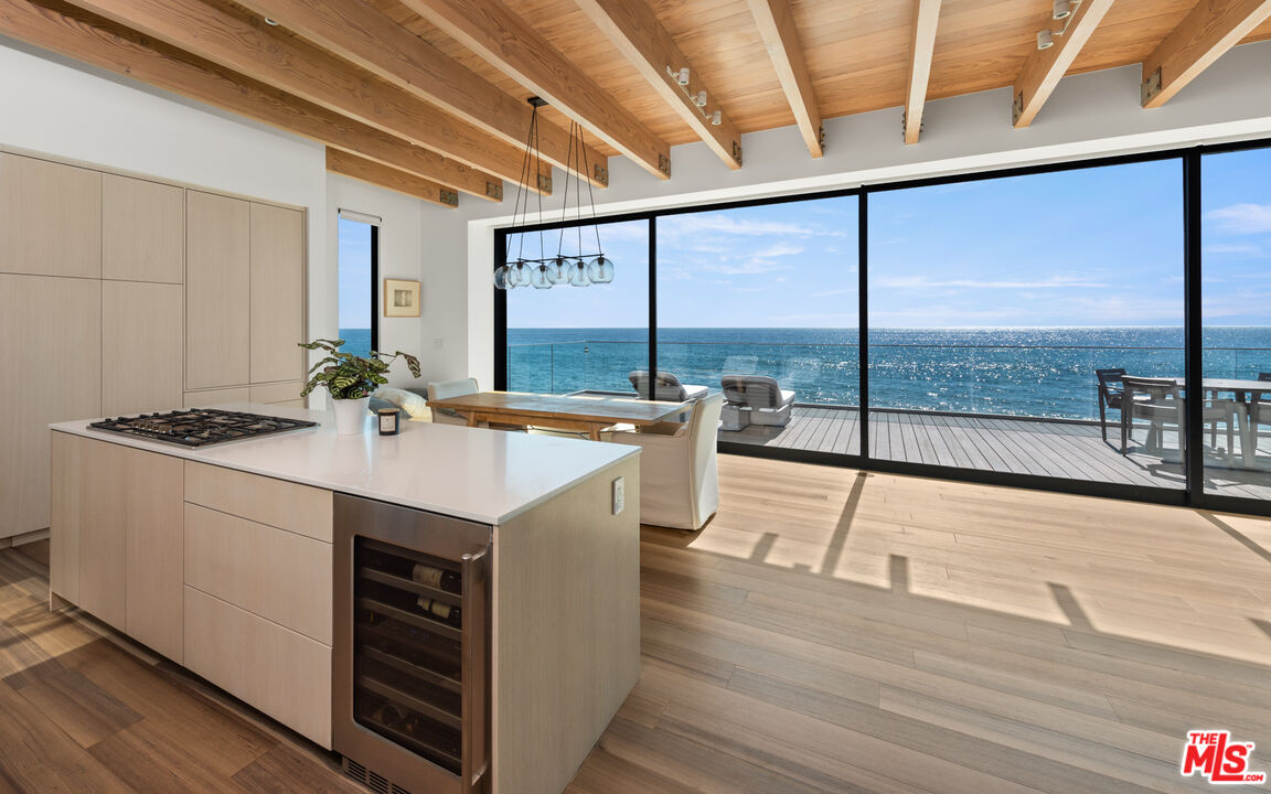 24604 Malibu Road Malibu, CA 90265 - Photo 3 of 17 a kitchen with a sink and large window