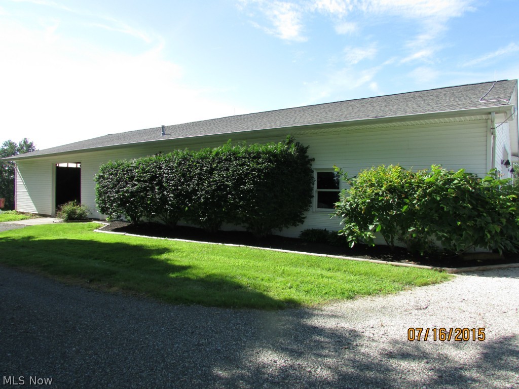 4645 Rock Spring Road Ravenna, OH 44266 - Photo 4 of 25 The 40 x 60 heated barn/garage even has a 1/2 bath. There is a large parking area on both sides of this building and 3 large commercial size doors. (Heated and many a persons dream building)!