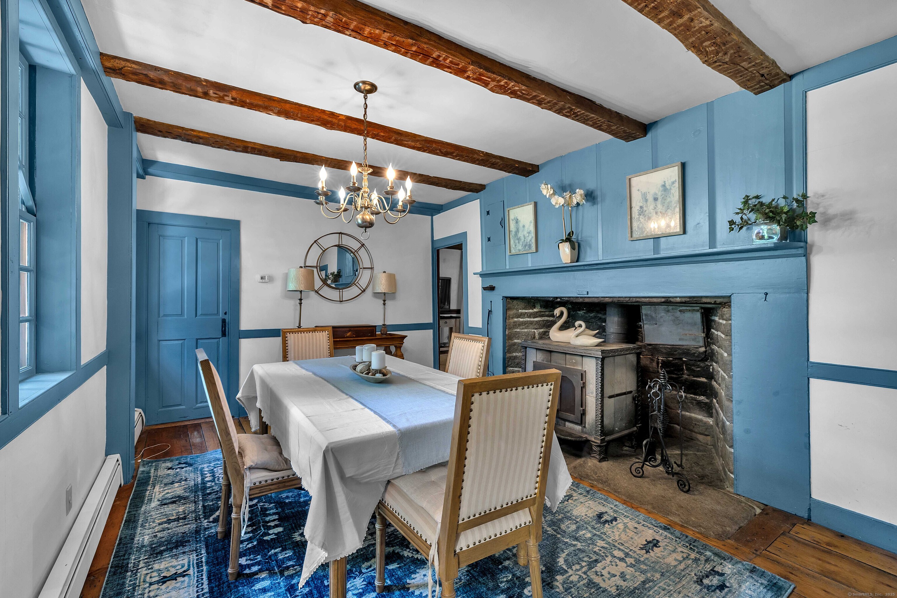448 Grove Beach Road North Westbrook, CT 06498 - Photo 21 of 40 a view of a dining room with furniture and chandelier
