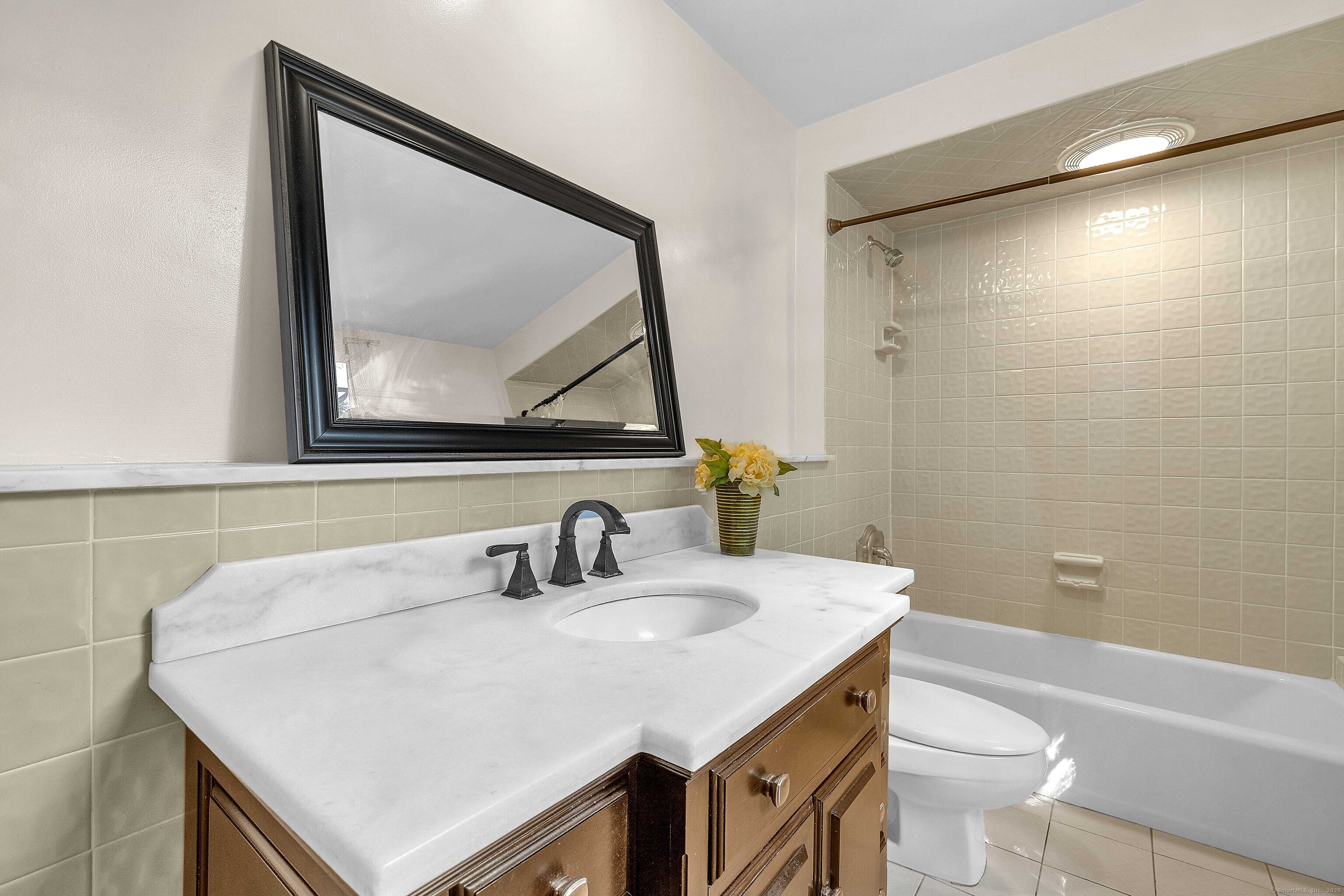 448 Grove Beach Road North Westbrook, CT 06498 - Photo 24 of 40 a bathroom with a sink a toilet and a mirror