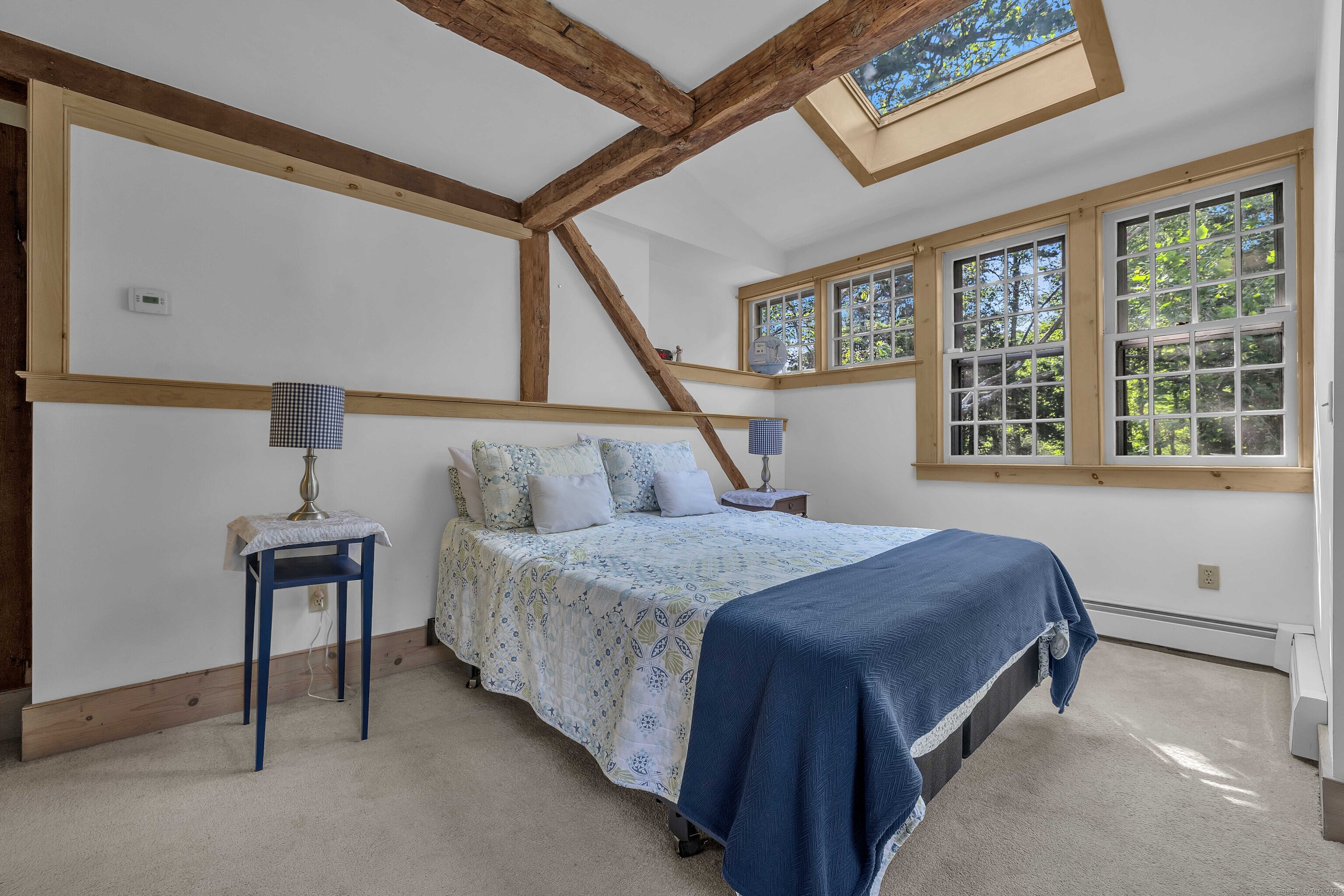 448 Grove Beach Road North Westbrook, CT 06498 - Photo 32 of 40 a bedroom with a bed and a window