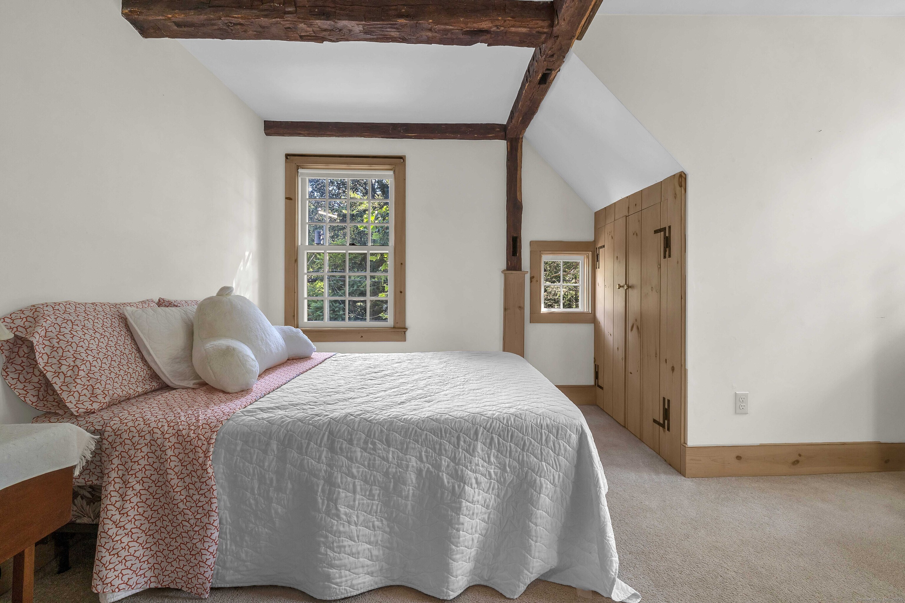 448 Grove Beach Road North Westbrook, CT 06498 - Photo 33 of 40 a bed sitting in a bedroom next to a window