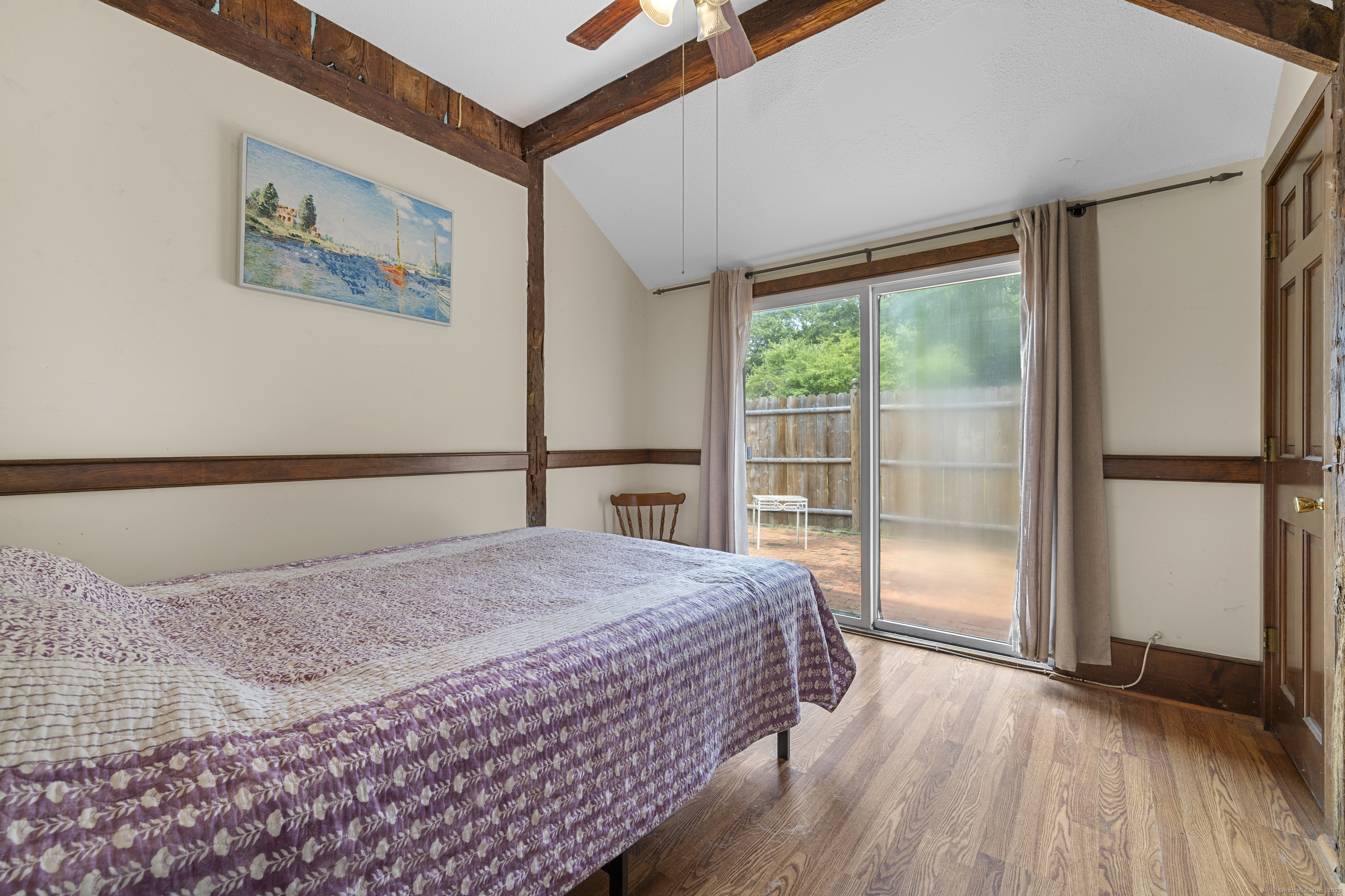 448 Grove Beach Road North Westbrook, CT 06498 - Photo 39 of 40 a bedroom with a bed and a large window