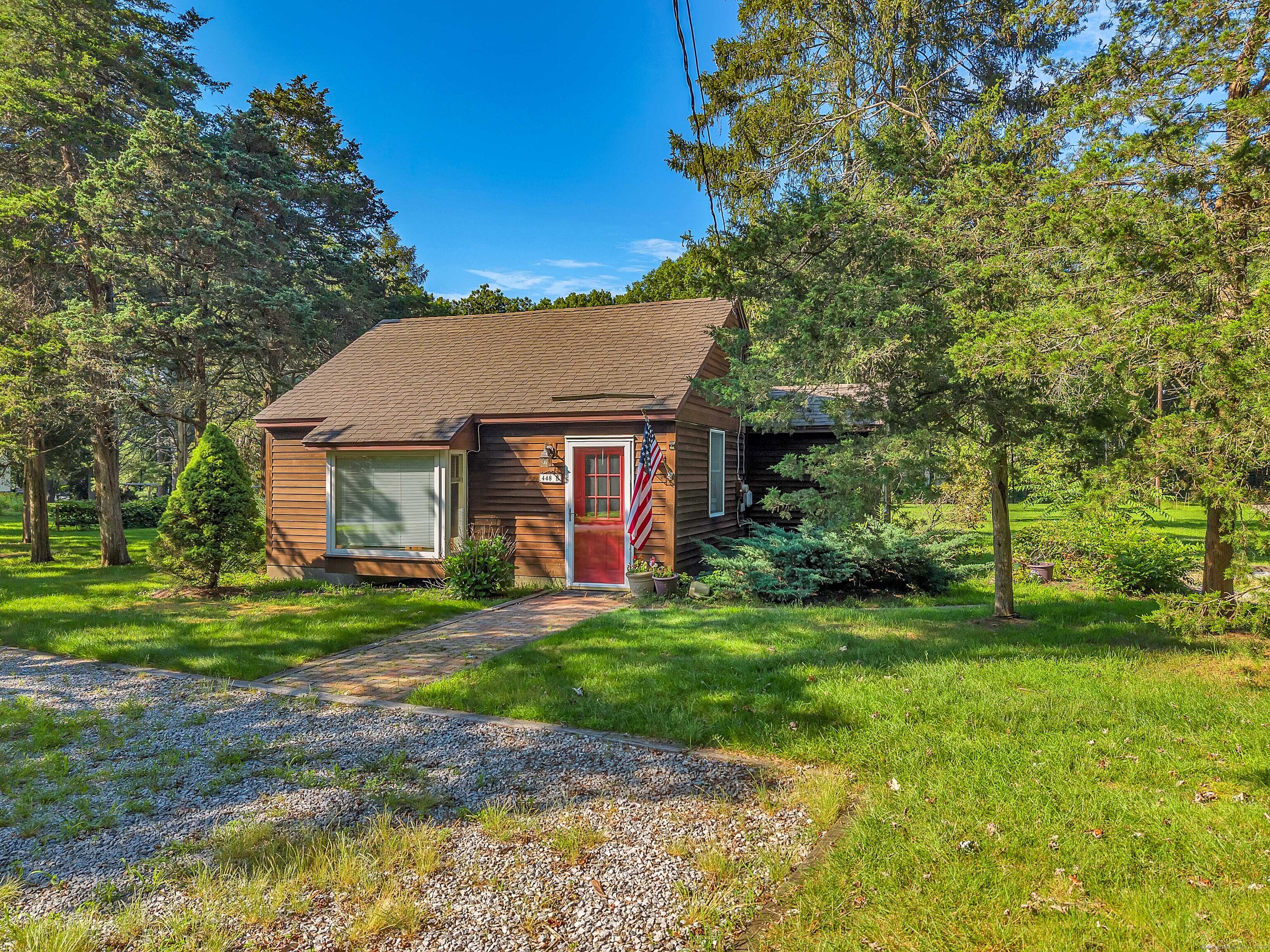 448 Grove Beach Road North Westbrook, CT 06498 - Photo 9 of 40 a view of a house with a yard