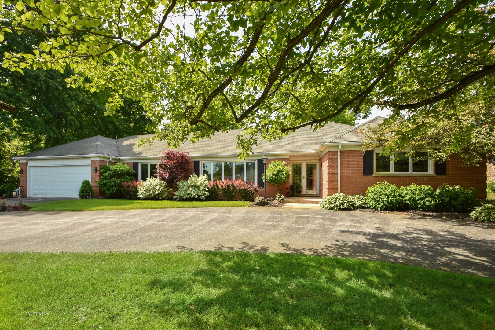 570 Aberdeen Road Frankfort, IL 60423 - Photo 1 of 20 a front view of a house with a garden and trees