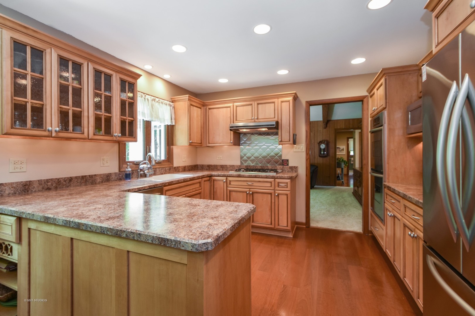 570 Aberdeen Road Frankfort, IL 60423 - Photo 6 of 20 a kitchen with stainless steel appliances granite countertop a sink stove and refrigerator