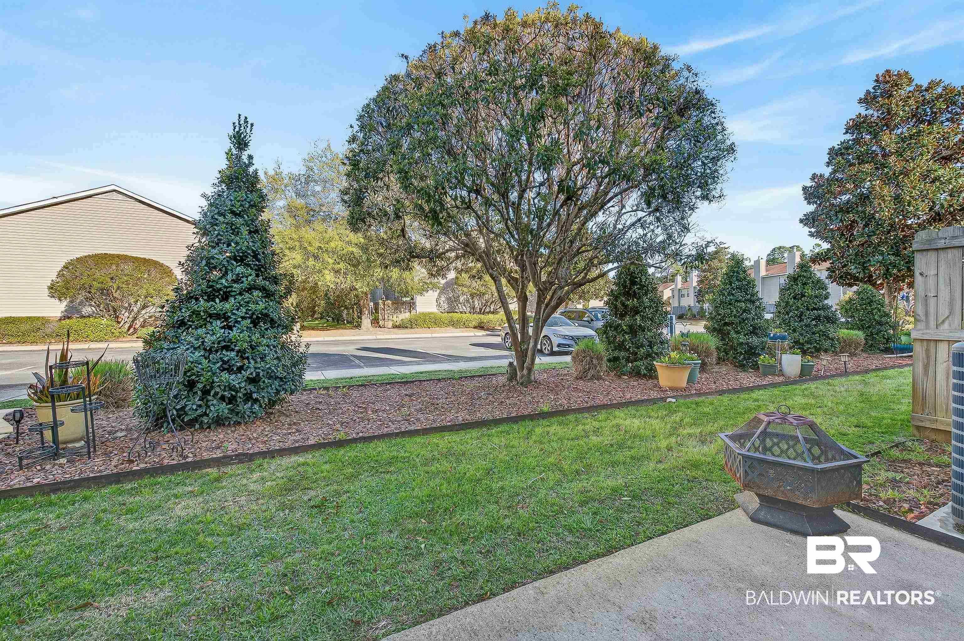 1517 Regency Road, Unit 114 Gulf Shores, AL 36542 - Photo 40 of 61 Back Patio & Parking Lot