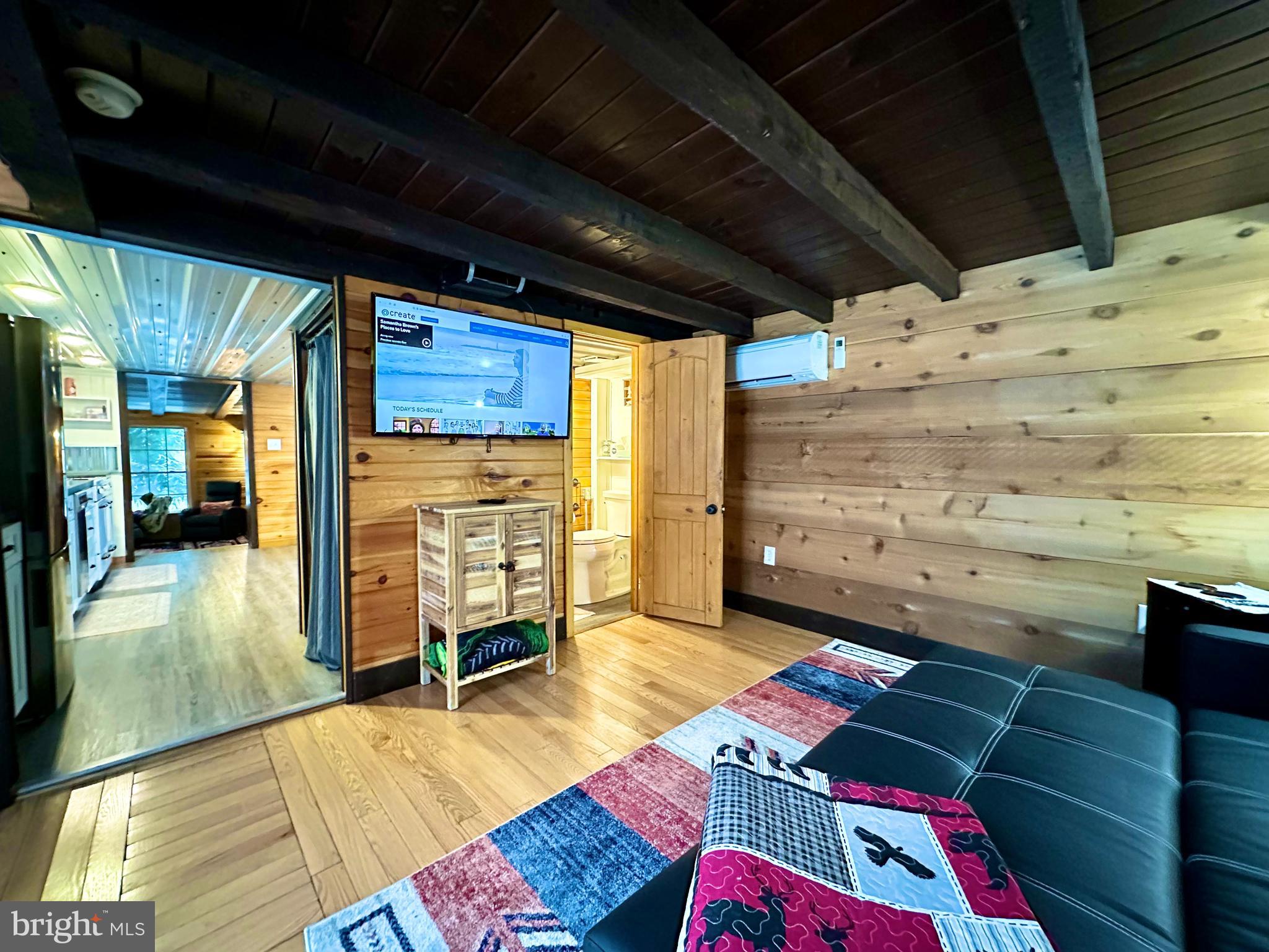 674 Bull Run Road Wrightsville, PA 17368 - Photo 29 of 62 a room with furniture and a flat screen tv