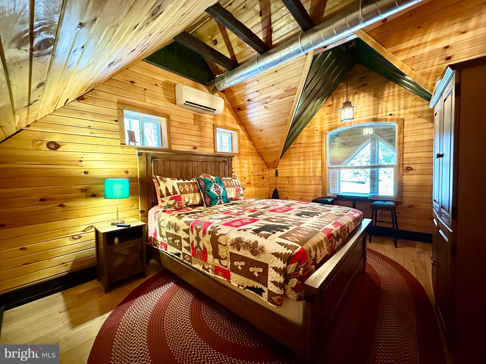 674 Bull Run Road Wrightsville, PA 17368 - Photo 34 of 62 a bedroom with a bed and wooden floor