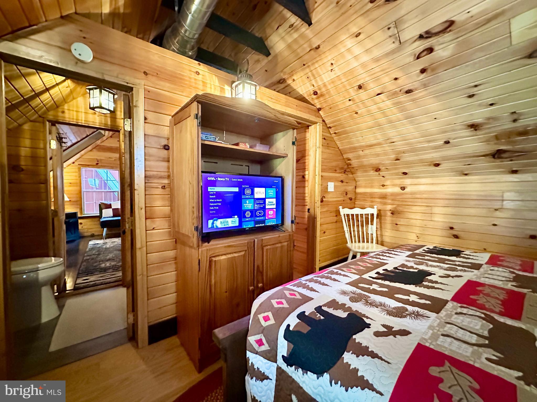 674 Bull Run Road Wrightsville, PA 17368 - Photo 36 of 62 a bedroom with a bed and a flat screen tv