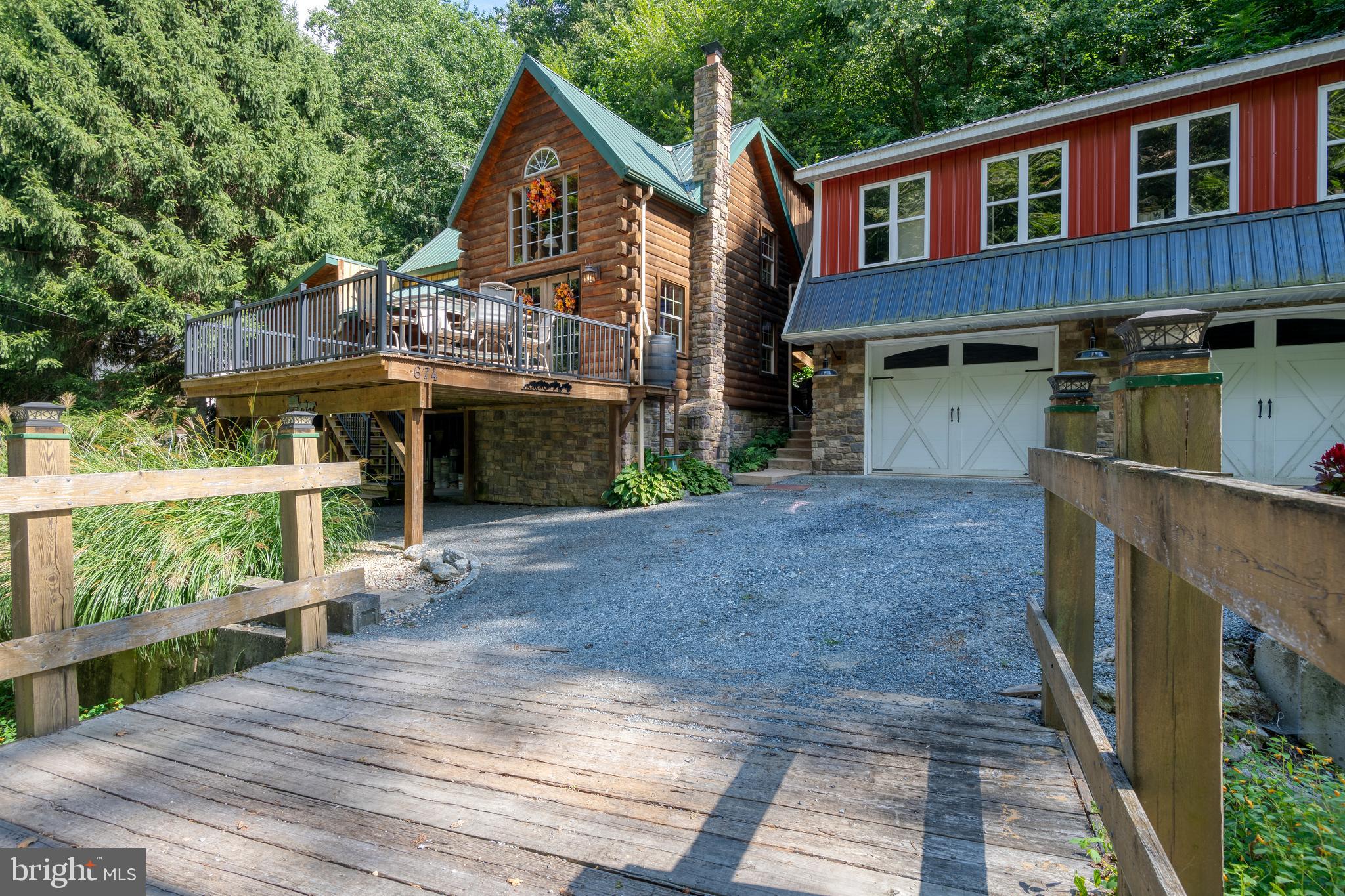 674 Bull Run Road Wrightsville, PA 17368 - Photo 4 of 62 a front view of a house with a yard and garage