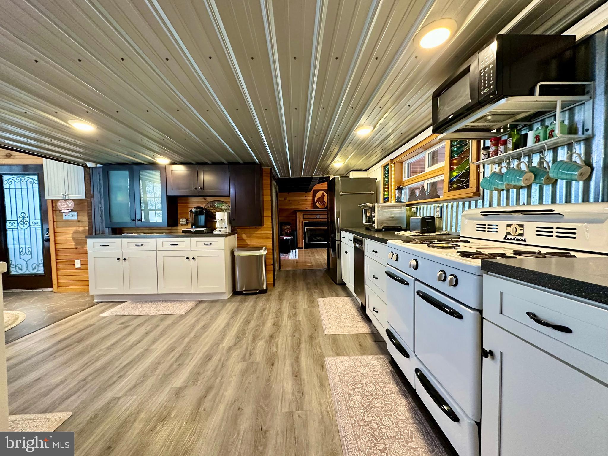 674 Bull Run Road Wrightsville, PA 17368 - Photo 9 of 62 a large kitchen with stainless steel appliances kitchen island granite countertop a lot of cabinets a sink and a counter space