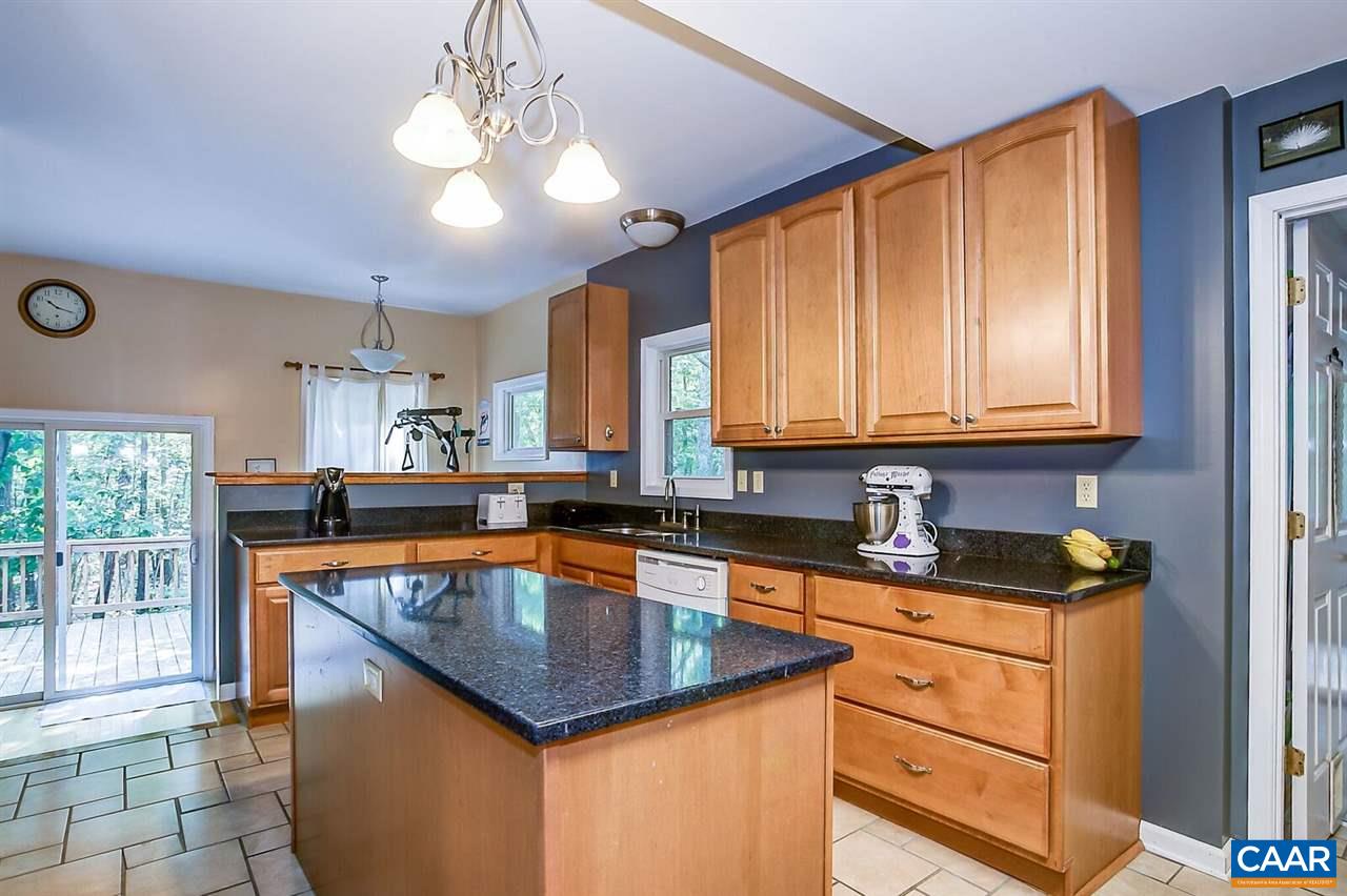 1205 Three Chopt Road Kents Store, VA 23084 - Photo 3 of 20 a kitchen with granite countertop kitchen island stainless steel appliances a sink stove and cabinets