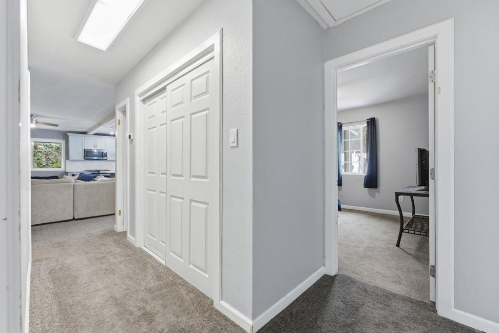 10019 Tamil Road Lakeside, CA 92040 - Photo 14 of 22 a view of a hallway with a livingroom and a livingroom with furniture