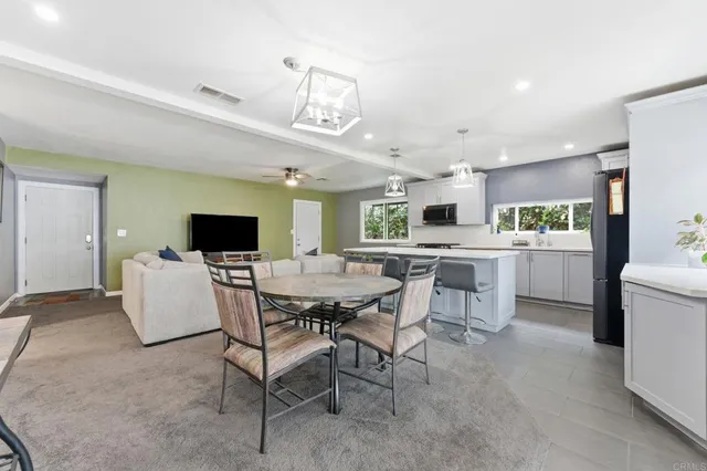 a kitchen with a table and chairs in it