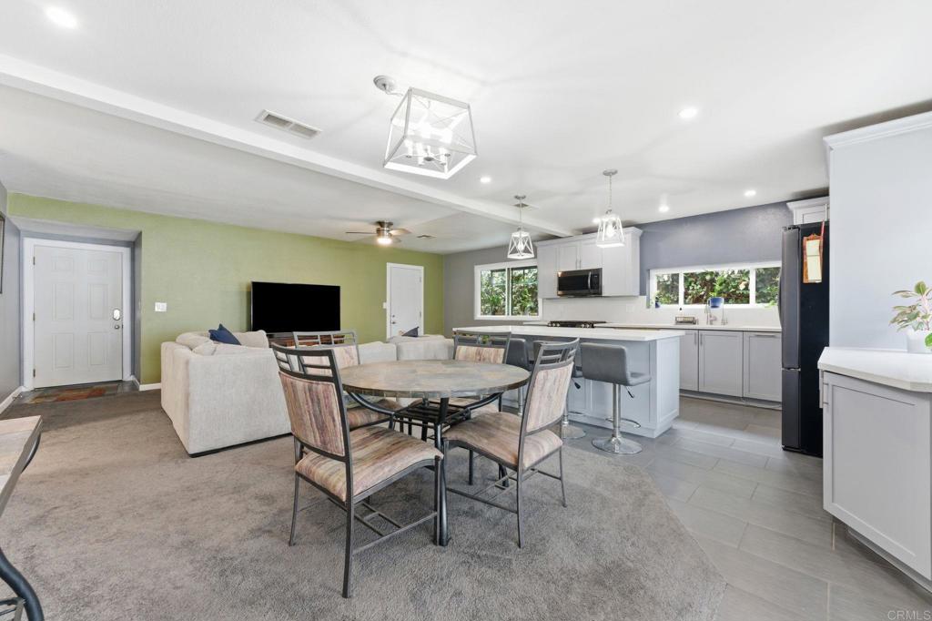 10019 Tamil Road Lakeside, CA 92040 - Photo 8 of 22 a kitchen with a table and chairs in it