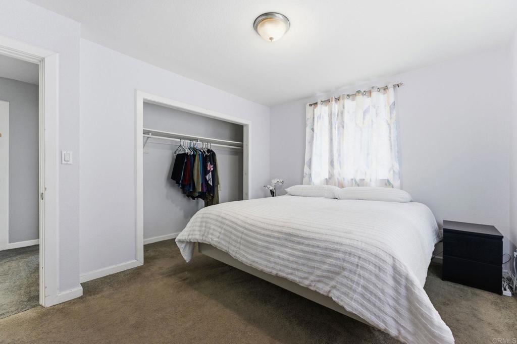 10019 Tamil Road Lakeside, CA 92040 - Photo 10 of 22 a bedroom with a bed and a walk in closet