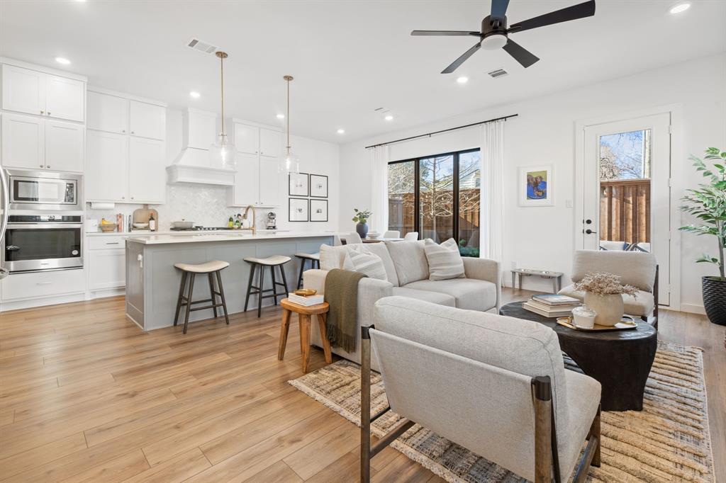 2249 Rook Drive Dallas, TX 75211 - Photo 1 of 1 a living room with stainless steel appliances kitchen island granite countertop furniture and a wooden floor