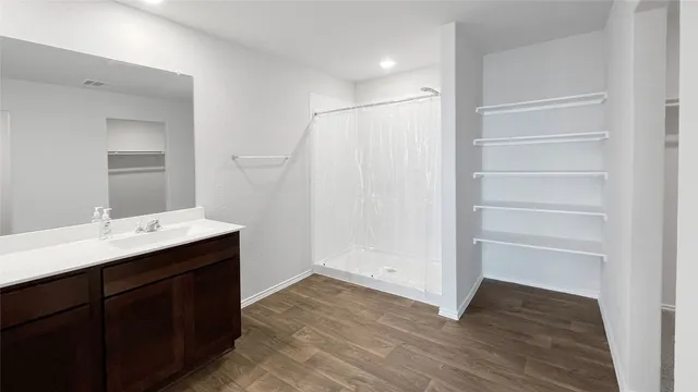 a bathroom with a sink and mirror