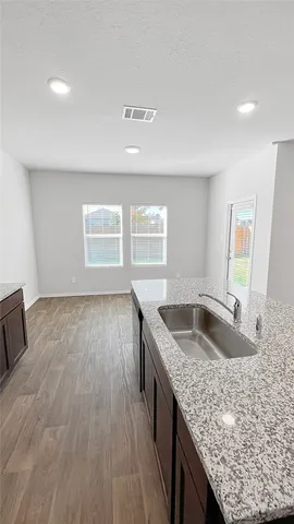 a kitchen with granite countertop a sink and a granite counter tops