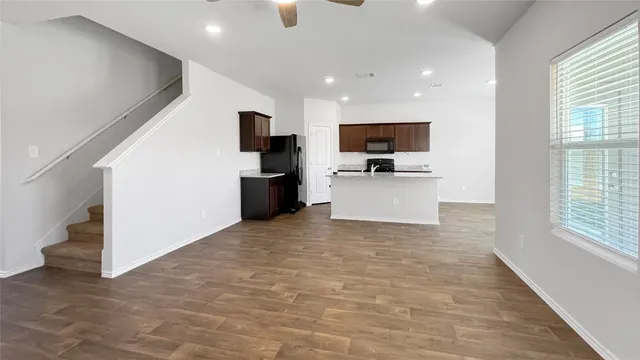 a view of living room with furniture and flat screen tv