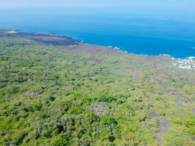 a view of a large body of water with a mountain in the background
