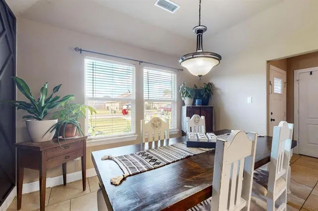 a view of a livingroom with furniture and a window