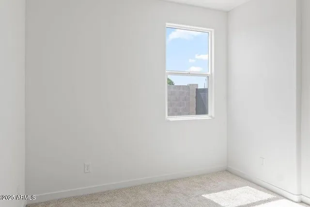 a bathroom with double vanity sink and two mirror
