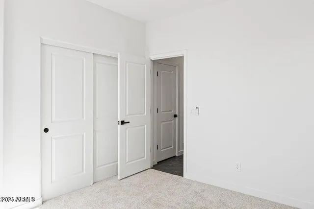 a bathroom with a granite countertop sink mirror and vanity