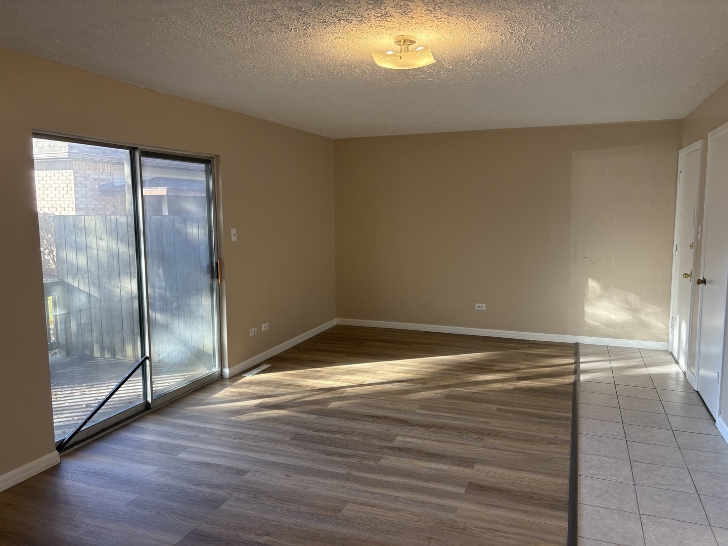 1119 South Curtis Avenue, Unit A1 Kankakee, IL 60901 - Photo 2 of 8 a view of empty room with wooden floor