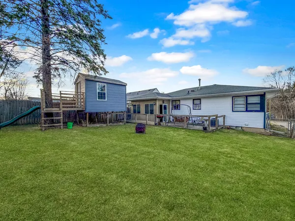 a view of a house with a back yard