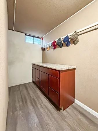 a view of hallway with wooden floor