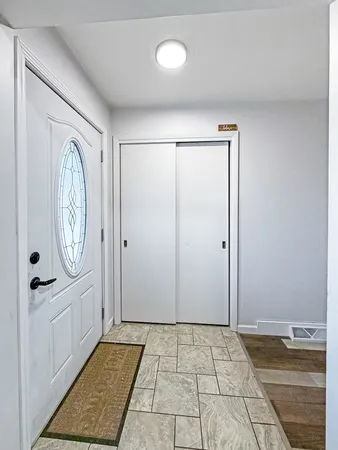 a bathroom with a sink mirror and a bathtub