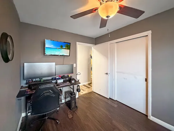 a spacious bedroom with a bed and a window