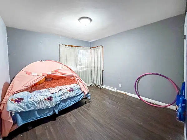 a view of a livingroom with wooden floor