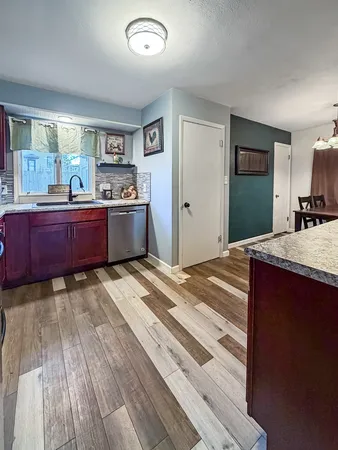 a room with a bed and a dresser